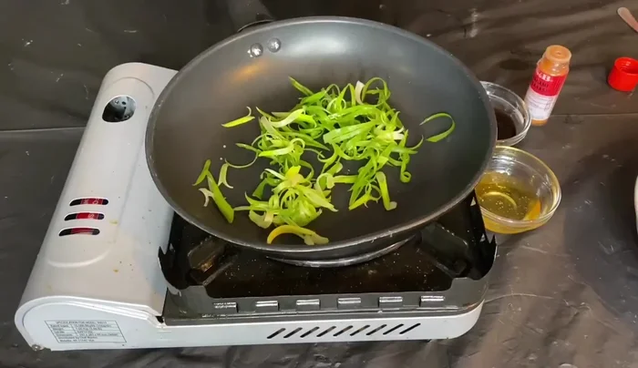 Prepare the scallion soy glaze: While the salmon broils, combine chopped spring onion, soy sauce, and honey. Simmer until slightly thickened to form a glaze.