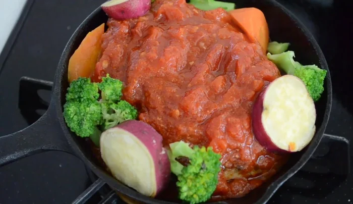 Garnish with broccoli, sweet potato, and carrot.