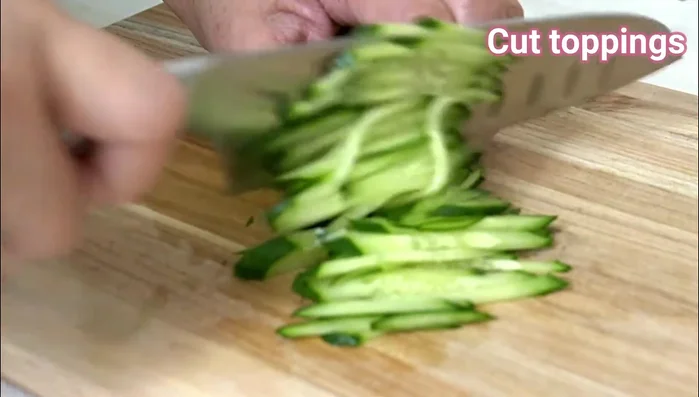 Use the press or your hands to firmly press the sushi until it is tightly packed.