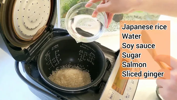 Add all ingredients (except green onions) to the rice cooker. Mix well.