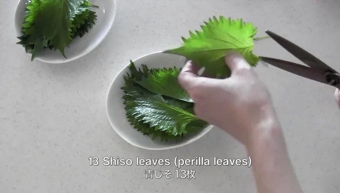Wash and halve shiso leaves.
