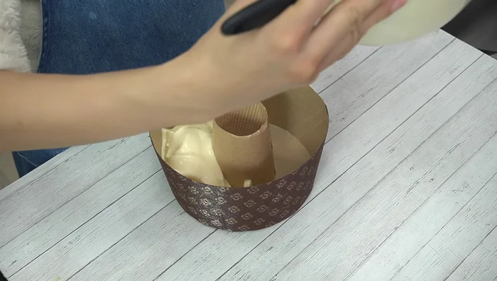 Pour batter into the chiffon cake mold, filling it halfway, then rotating to fill evenly. Tap the mold gently to remove large air bubbles.