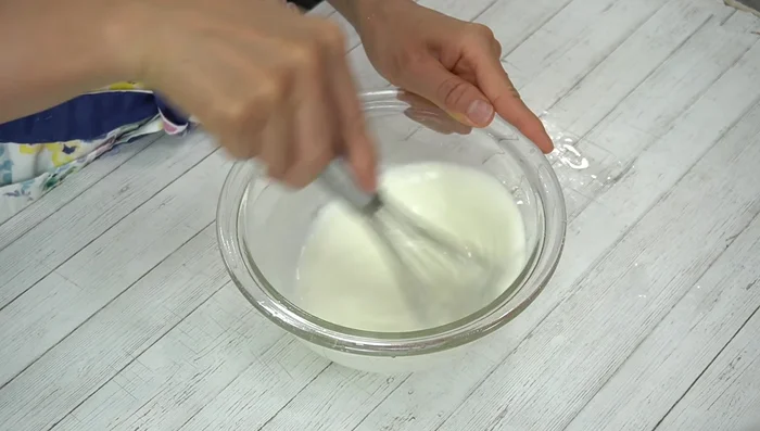 Mix well the yogurt until smooth. If very cold, warm slightly in a hot water bath.