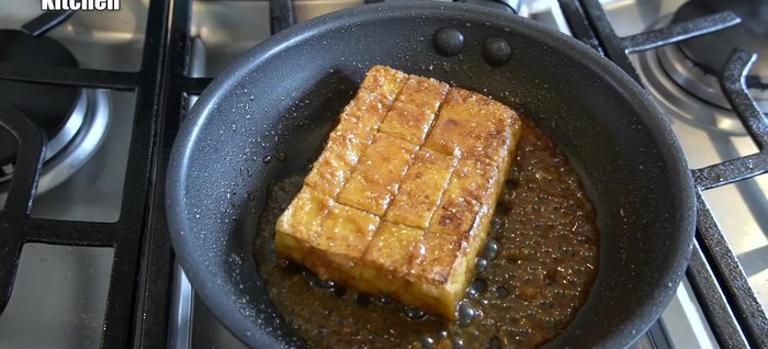 Place the grilled tofu in the pan with the miso sauce. Add sliced cheese on top and cover. Let it simmer using the residual heat until the cheese melts.