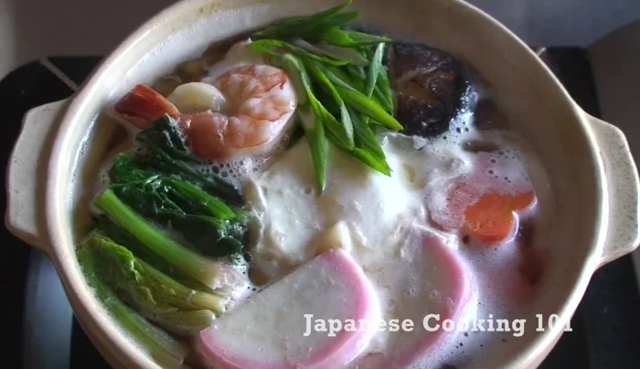 Add green onions and shichimi togarashi (optional).