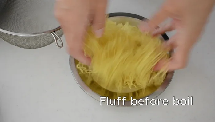 Cook ramen noodles in boiling water for 1 minute on high heat. Drain and remove as much moisture as possible.