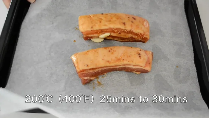 Preheat oven to 200 degrees Celsius. Bake marinated pork for 25-30 minutes. Check with a skewer; if hot and the juice runs out translucent, it's done. Let it rest for at least 30 minutes before slicing.