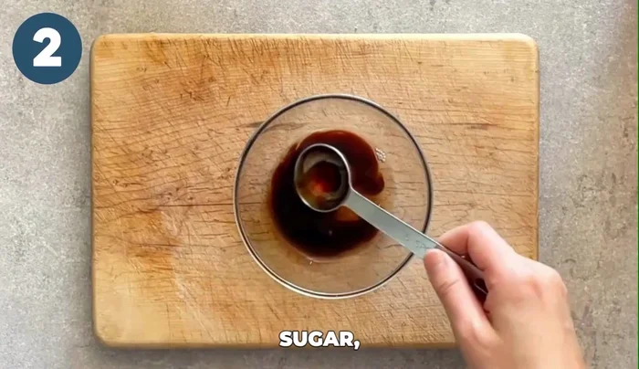 Combine miso paste, soy sauce, sugar, water, and grated ginger in a small bowl. Mix well until the miso is fully incorporated.