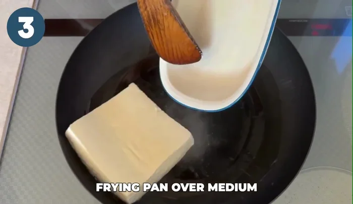 Heat vegetable oil in a frying pan over medium heat. Add the tofu, stirring constantly until the water evaporates and the tofu becomes dry.