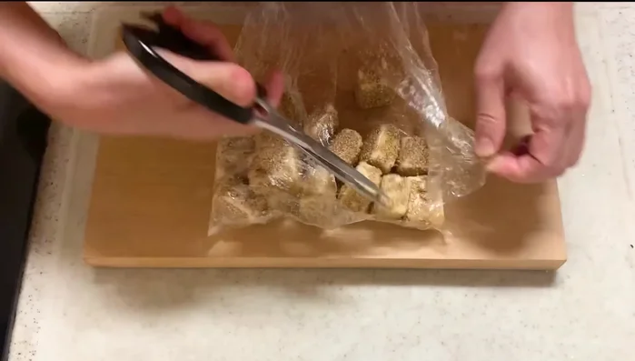 Cut the bag to allow easier access to the coated hanpen.