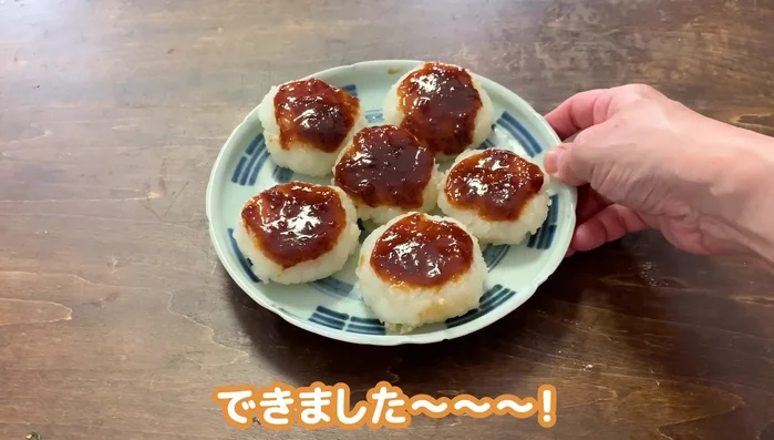 Spread the cooled sweet miso paste generously over the cooked rice balls.