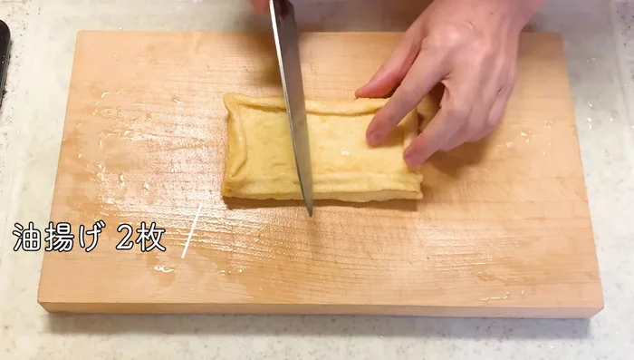Cut the fried tofu into strips.