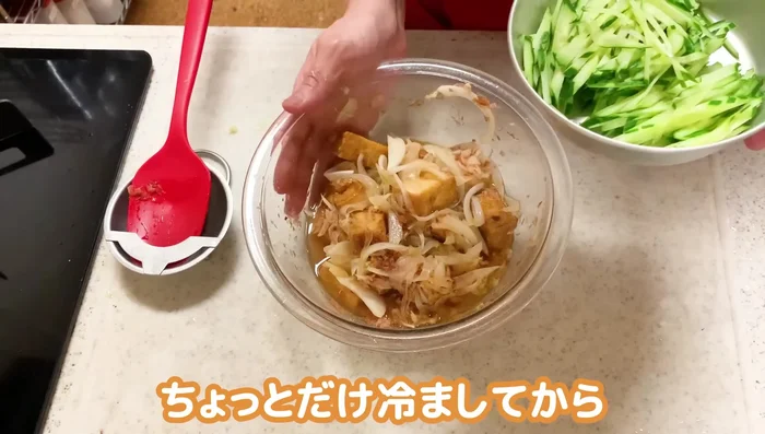 Let the mixture cool slightly before adding the cucumbers to maintain their crispness.