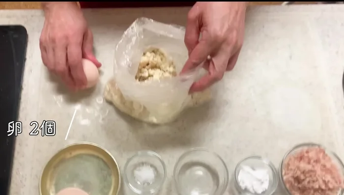 Add the eggs, salt, potato starch, and water to the bag with the crushed tofu. Mix thoroughly until the egg is evenly colored.