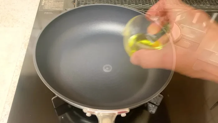 Sauté onions: Heat olive oil in a frying pan. Add onions and sauté until soft over medium-low heat.