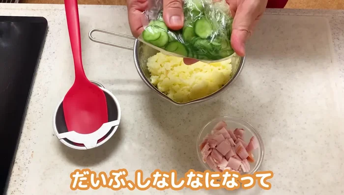 Once the potatoes have cooled, add the cucumbers (including any released water), ham, and mayonnaise. Mix gently.
