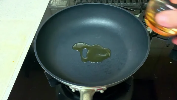 Remove the cabbage. Add more sesame oil to the pan, add the tofu and fry until lightly browned on both sides.