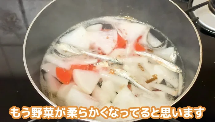 After 5 minutes, add the deep-fried tofu. Continue to simmer for about 3 more minutes.