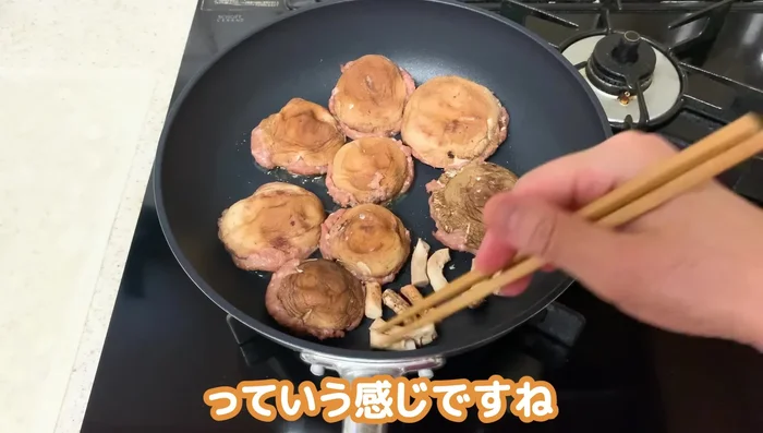 Cook for about 23 minutes, flipping once the meat side is cooked through. Add the reserved shiitake stems to the pan during cooking and stir-fry together.