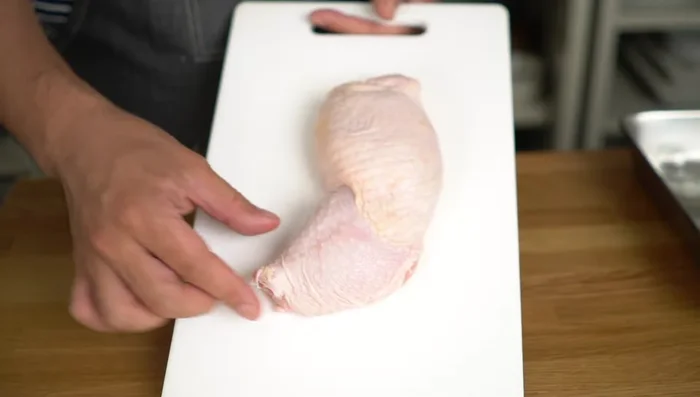Cut the chicken: Make a few cuts on the thicker part of the chicken thigh to ensure even cooking and tenderness. Cut the chicken thigh into 6 equal pieces.