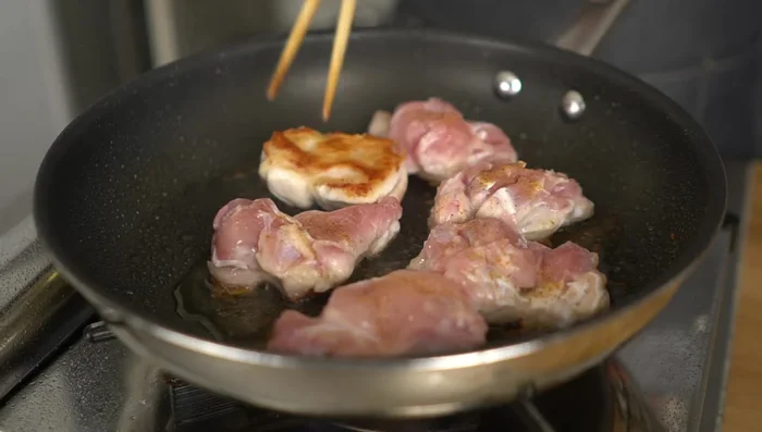 Flip and cook: Once the skin is crispy, flip the chicken and continue cooking over low-medium heat for about 4 minutes. The oil released from the chicken will splatter.