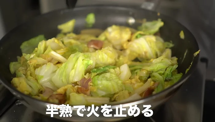 Drizzle soy sauce over the mixture, stir, and season with pepper.