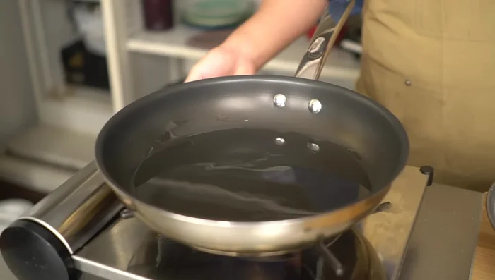 Heat oil in a frying pan. Fry the battered pork until golden brown and crispy (about 2 minutes per side).
