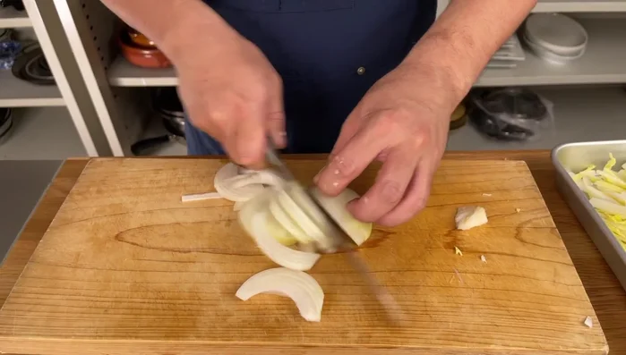 Cut the onion into thin slices parallel to the grain.