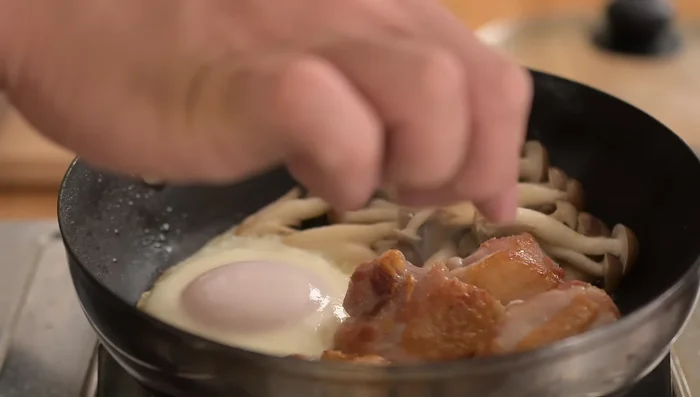 Remove the lid. Mix the mushrooms.