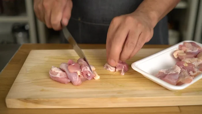 Cut the chicken thighs in half (or into thirds if large).