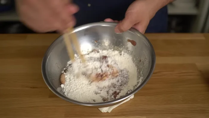 Add flour and mix until the mixture becomes thick and no longer sticky.