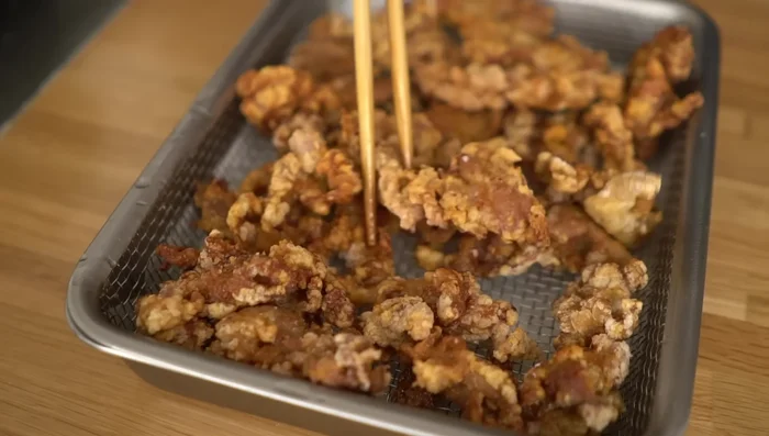 Remove the fried pork and serve immediately.