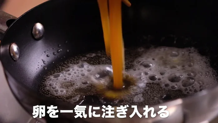Pour the egg mixture into the pan. It will expand from the edges.
