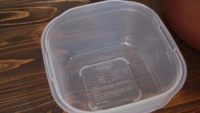 After fermentation, transfer the anko to a Tupperware container.