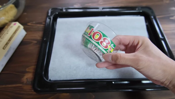 Line a baking sheet with parchment paper or use an aluminum case.