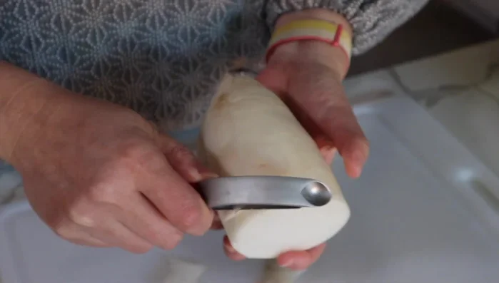 Peel and grate daikon radish for the dipping sauce.