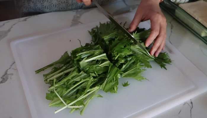 Cut mizuna into 2-inch pieces.
