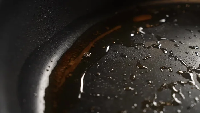 Cook garlic rice: Sauté minced garlic in the leftover beef tallow. Add rice, stir-fry, and season with salt, pepper, butter, and soy sauce.