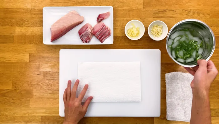 Dry the green onions with a paper towel to create curls.