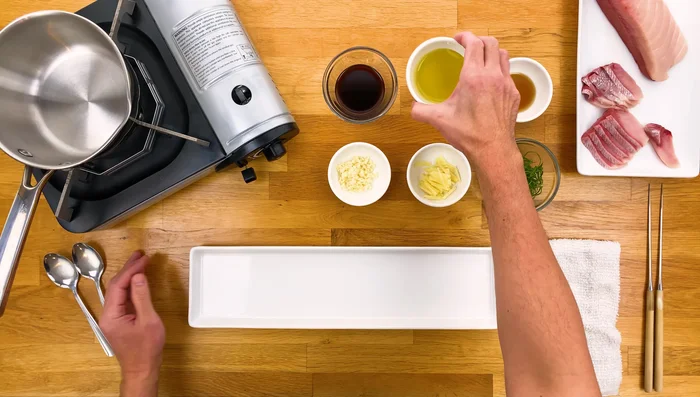 Heat olive oil and sesame oil in a small pot or pan over medium-high heat until smoking.