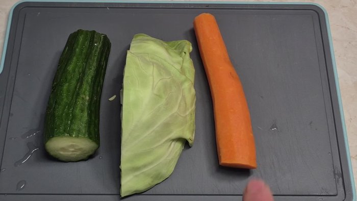 Cut the carrot in half, about four fingers long, then into smaller slices.