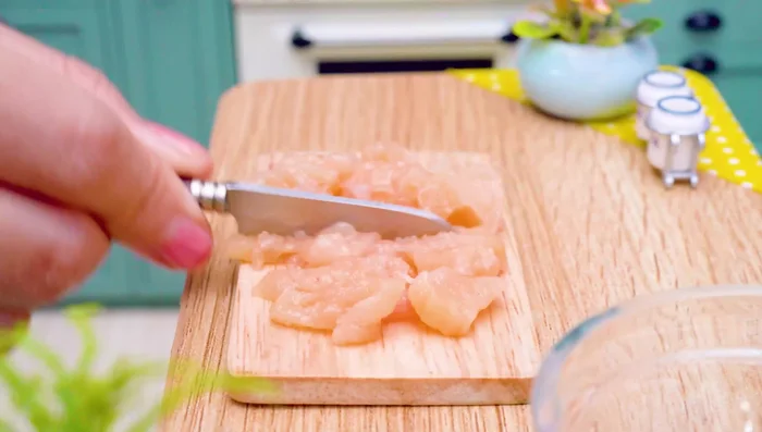 Prepare chicken: slice, chop, and mix with pepper, salt, chili powder, and milk. Roll and fry.