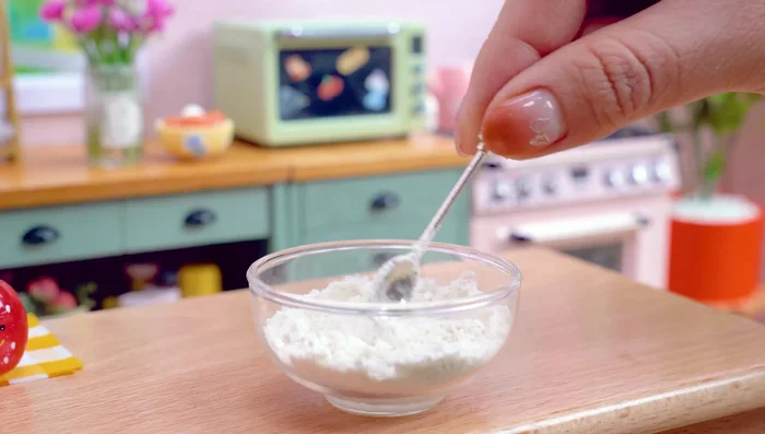 Prepare real pizza dough: mix yeast, salt, water, and olive oil. Knead and flatten the dough.