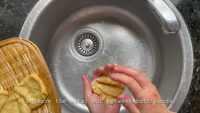 Once the agisan has cooled, squeeze out excess water.