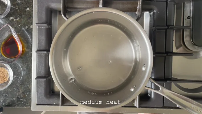 Make the udon dashi: In a separate pot, combine 400 mL of water, 1 teaspoon dashi powder, 1 tablespoon light soy sauce, 1 tablespoon mirin, 1 tablespoon sake, and a pinch of katsubushi. Bring to a boil.