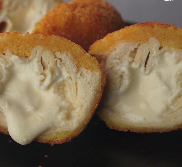 Drain the ice cream: Remove the fried ice cream balls and place them on a plate lined with paper towels to drain excess oil.