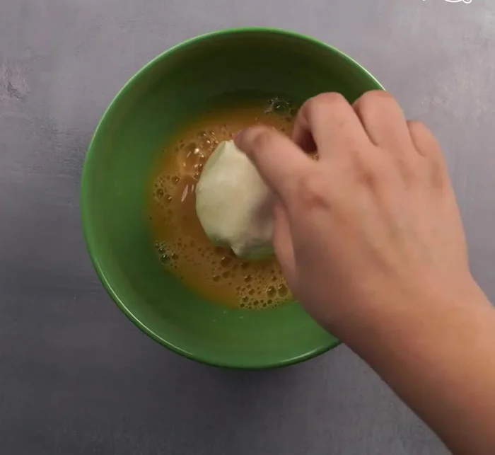 Coat the ice cream: Dip each ice cream ball into the batter, then into the breadcrumb mixture, ensuring they're fully coated.