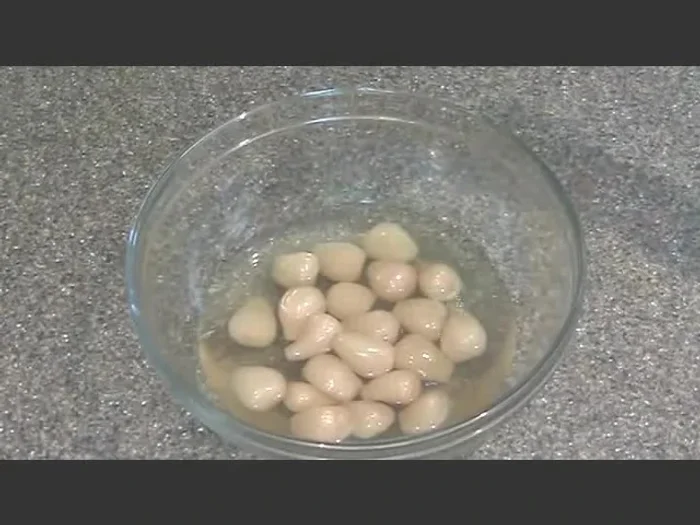 Add 1/2 cup of water, 3 1/2 tablespoons of distilled white vinegar, and 1/8 teaspoon of salt to the bowl.