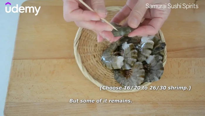 Prepare the shrimp: Devein, remove the base, make a shallow diagonal cut, and gently snap the shrimp to stretch the muscular fiber. Cut off the tail tips to remove water. Rinse and pat dry.