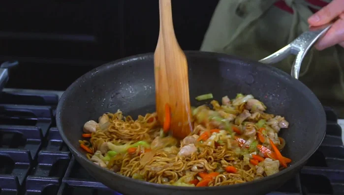 Combine the cooked ingredients and noodles. Stir-fry until everything is well combined.